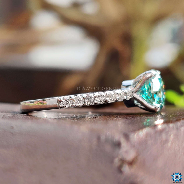 Pave setting ring with round cut moissanite.