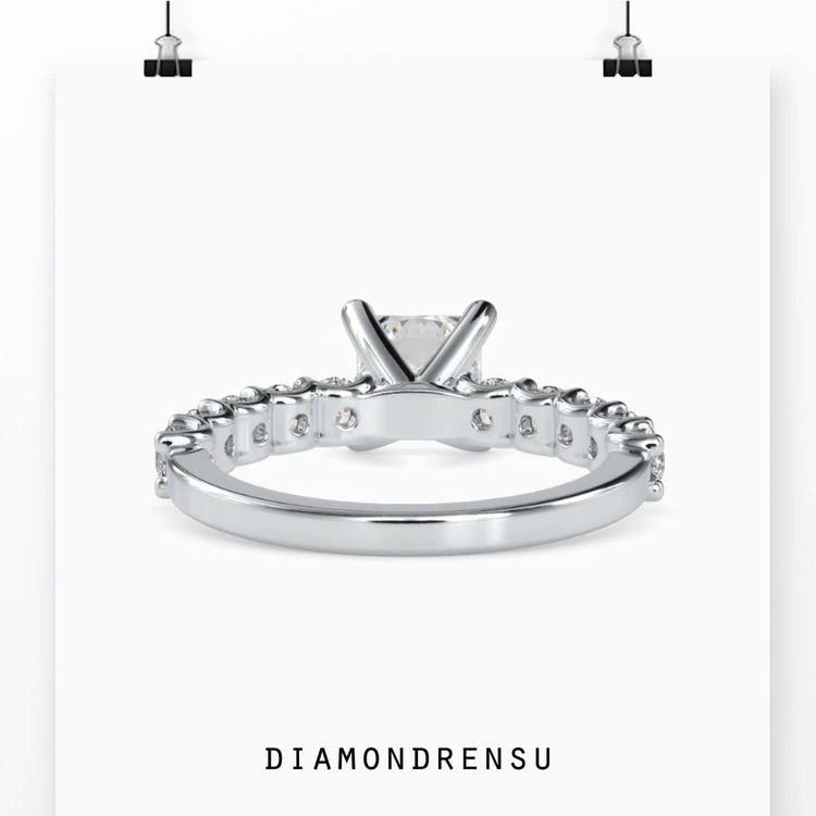 Princess cut diamond ring with white gold handmade setting.