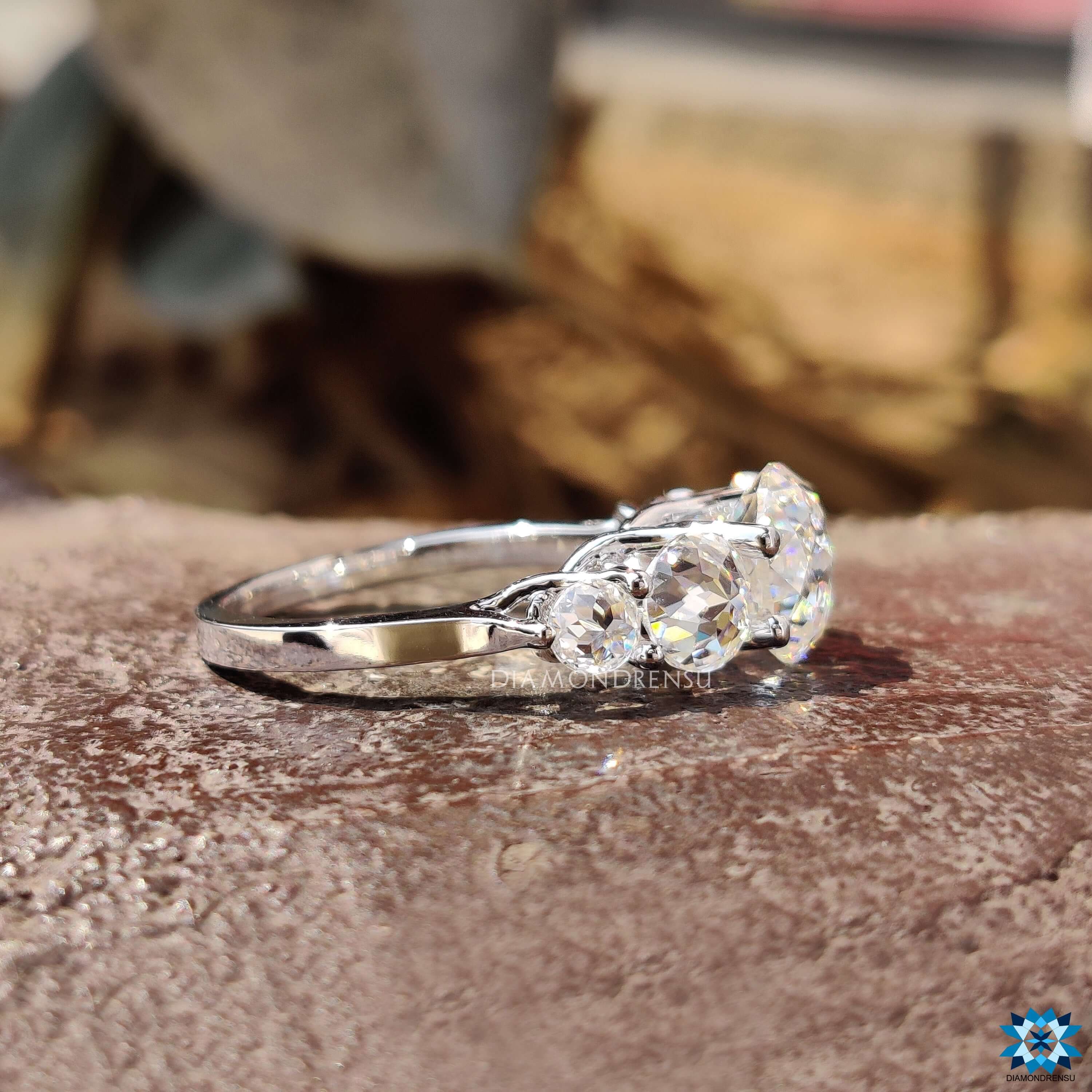 Custom engagement ring with five stone moissanite design.