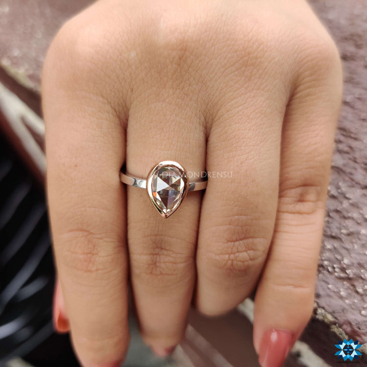 Rose cut pear shaped solitaire engagement ring.