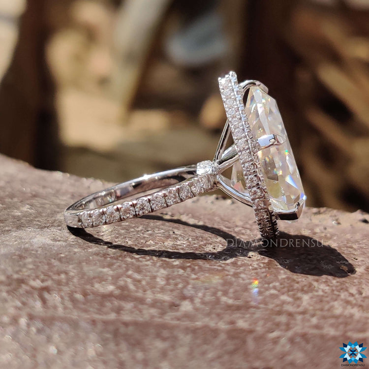 Double halo pear cut moissanite ring set in polished white gold.