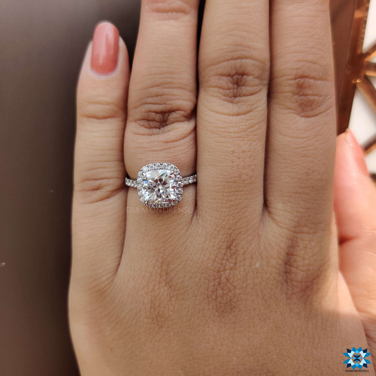 Custom moissanite engagement ring with cathedral and pave design.