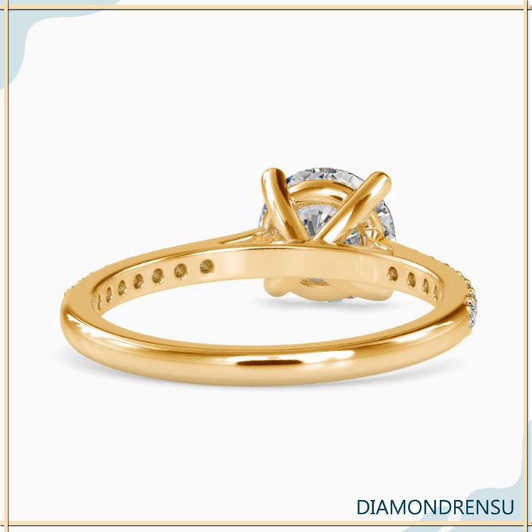 Lab grown diamond engagement ring with cathedral shank design.