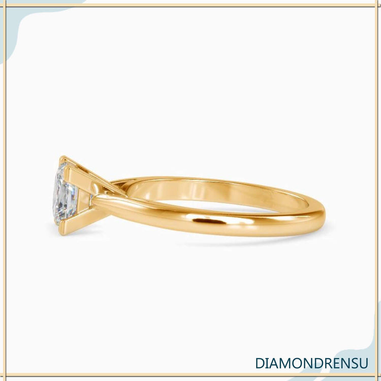 Designer ring featuring princess cut diamond and simple solitaire design.