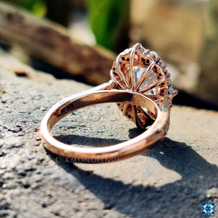 Moissanite ring with pave setting and halo design.