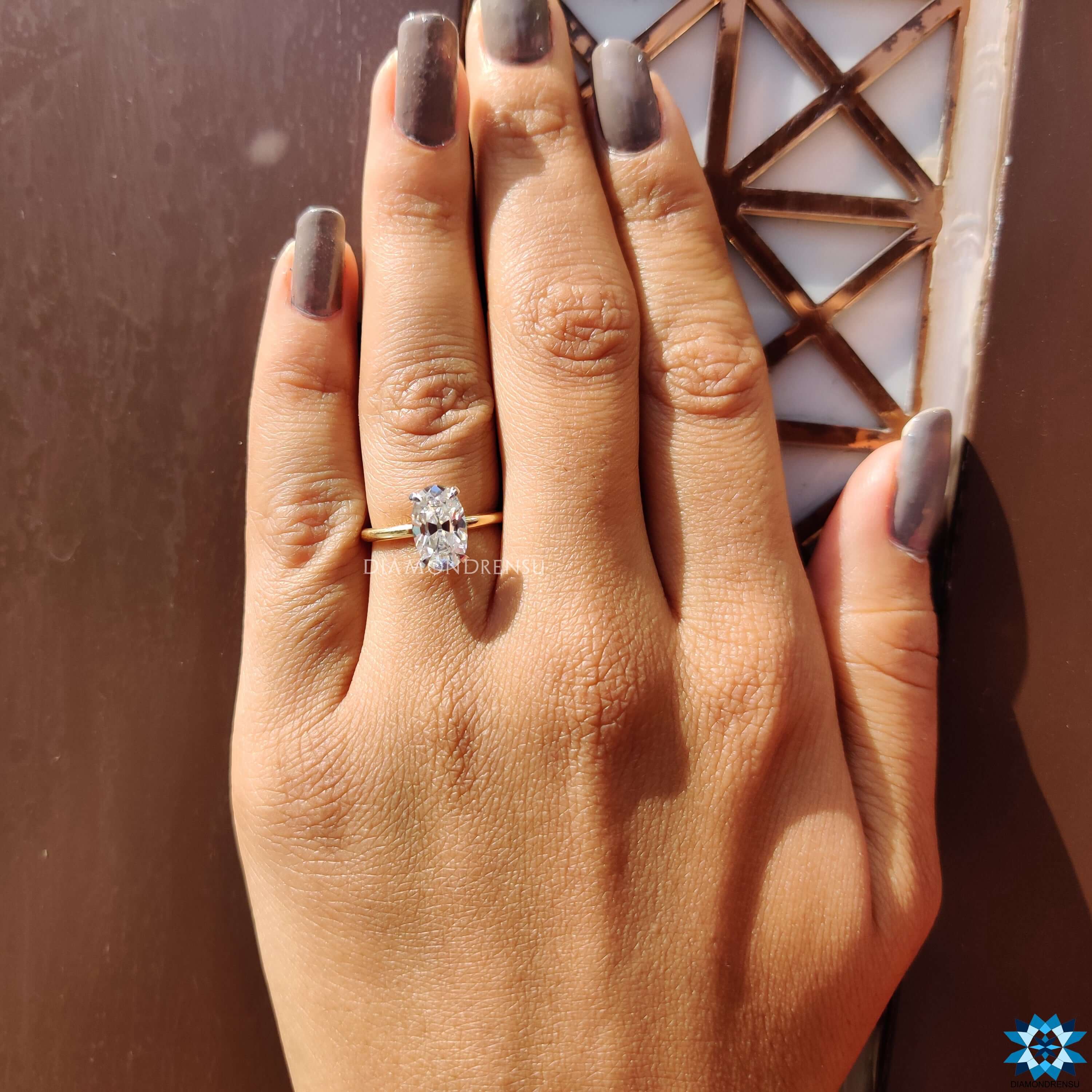 Yellow gold engagement ring with Moval old European cut stone.