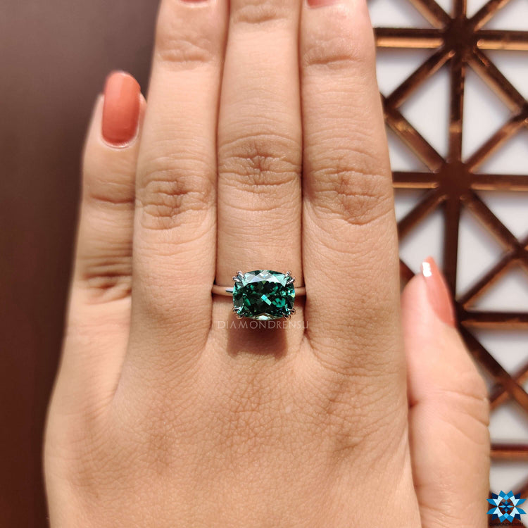 Solitaire moissanite ring with double prong setting.