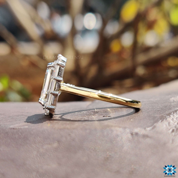 Emerald cut moissanite ring in vintage-inspired design.