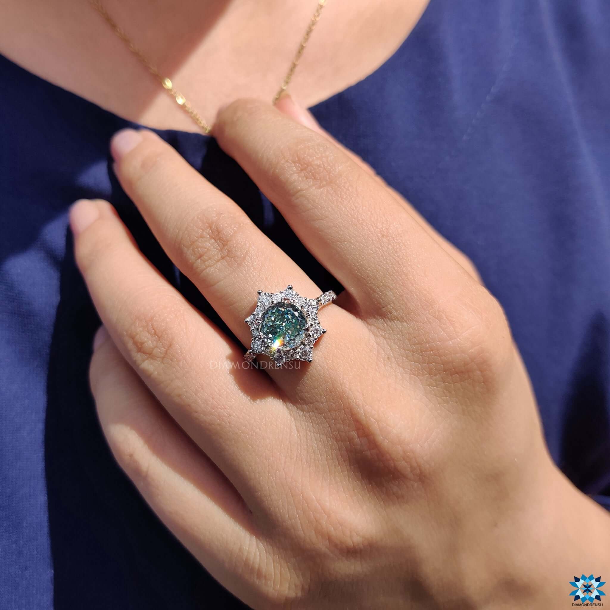 Handmade moissanite ring featuring pave set details.