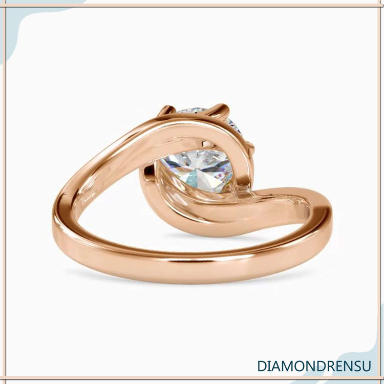 Diamondrensu UK ring with rose gold and solitaire setting.