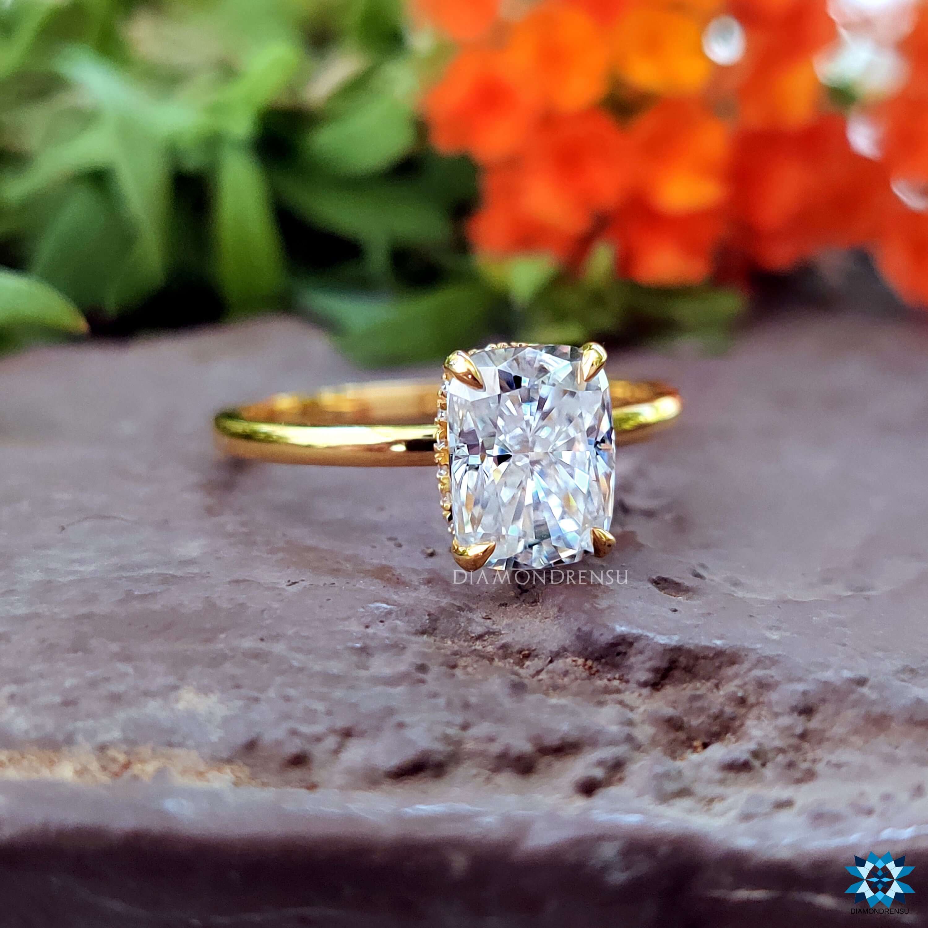Four prong setting on white gold moissanite ring.