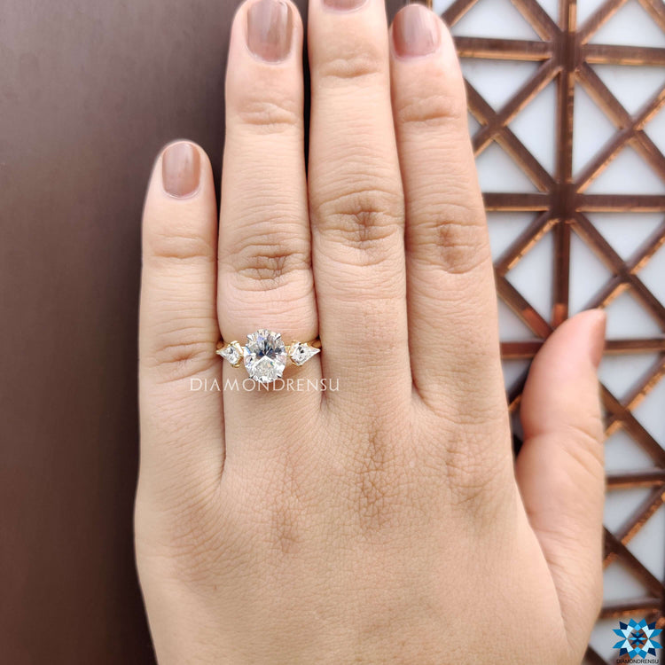 Oval cut moissanite ring in yellow gold.