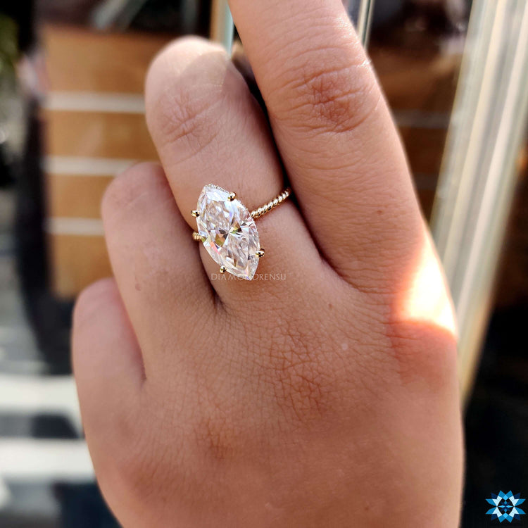 UK engagement ring with vintage-inspired milgrain details.