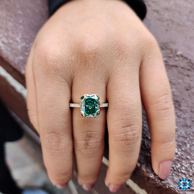 Handmade ring with vintage styling and green stone.