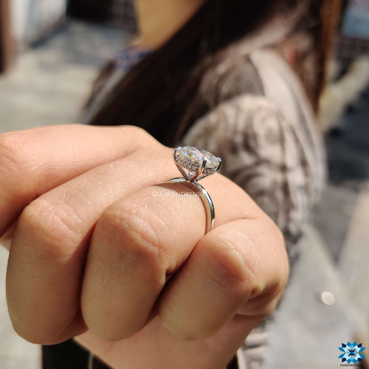 Handmade ring with moissanite solitaire and halo setting.