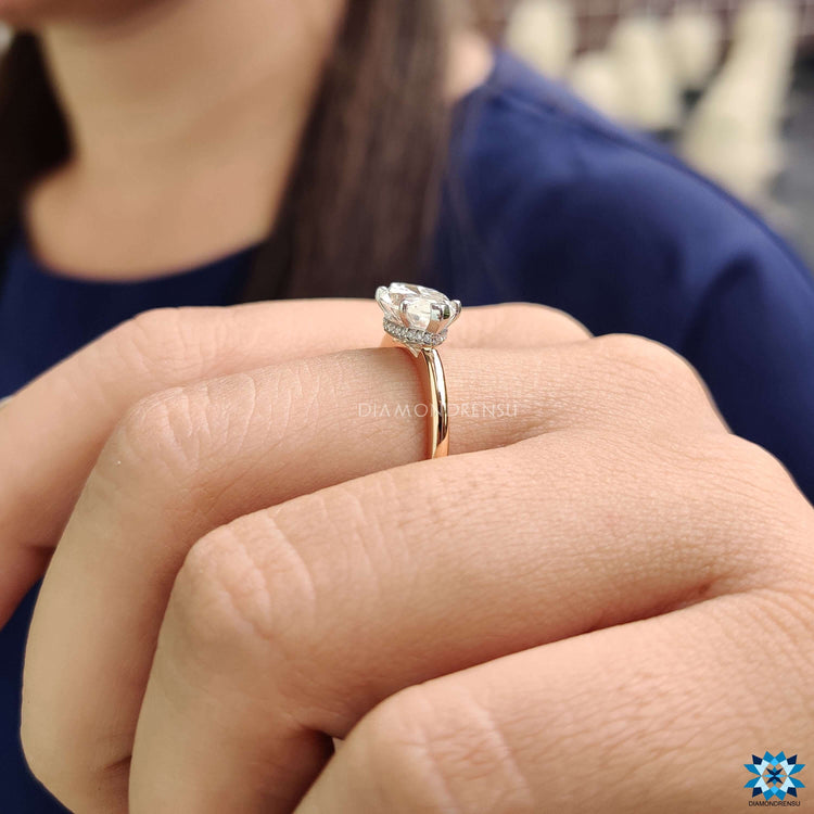 Custom marquise engagement ring in east-west style.