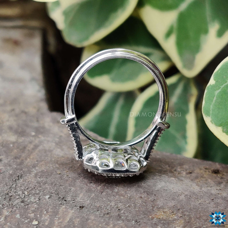 Classic white gold engagement ring featuring a vintage emerald ring design.