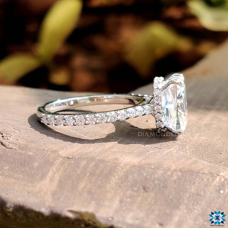 Hidden halo moissanite ring with a cushion cut center.