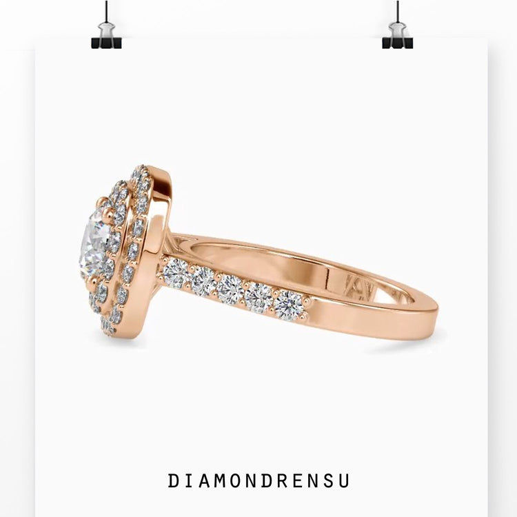 Handmade ring in rose gold with halo and pave design.