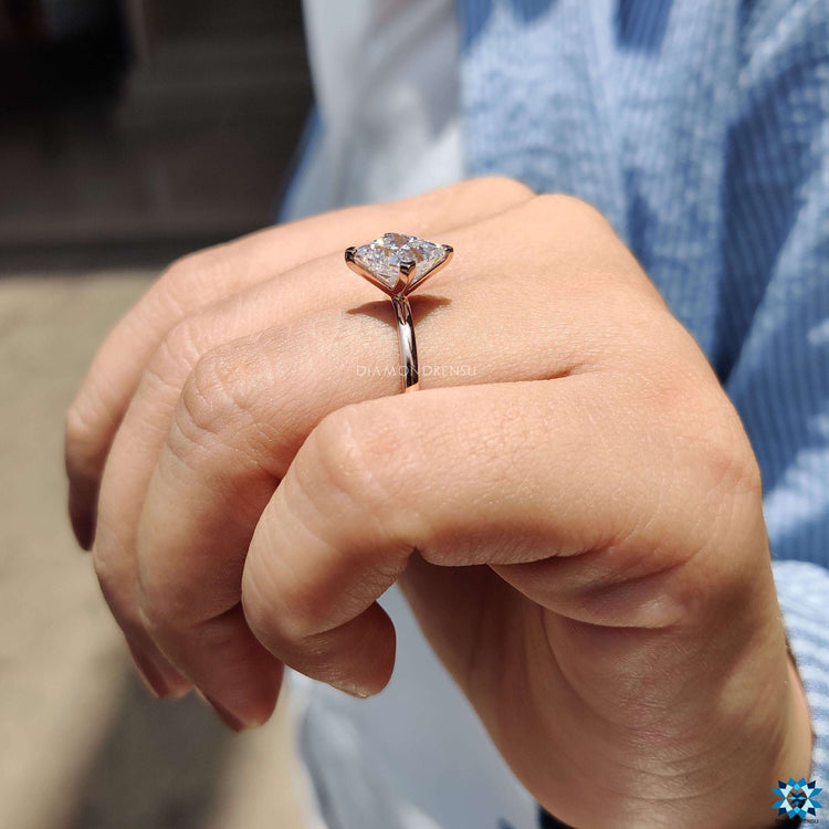 Princess cut ring with solitaire design.