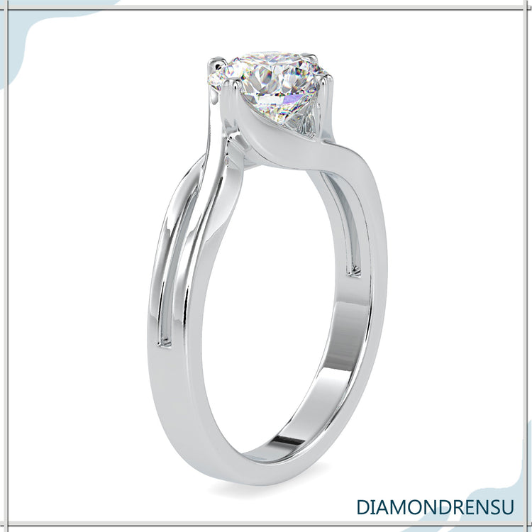 UK diamond ring featuring a handmade round cut solitaire diamond.