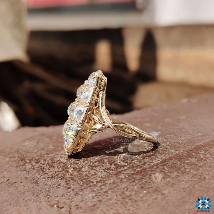 Yellow gold moissanite ring with prong setting.