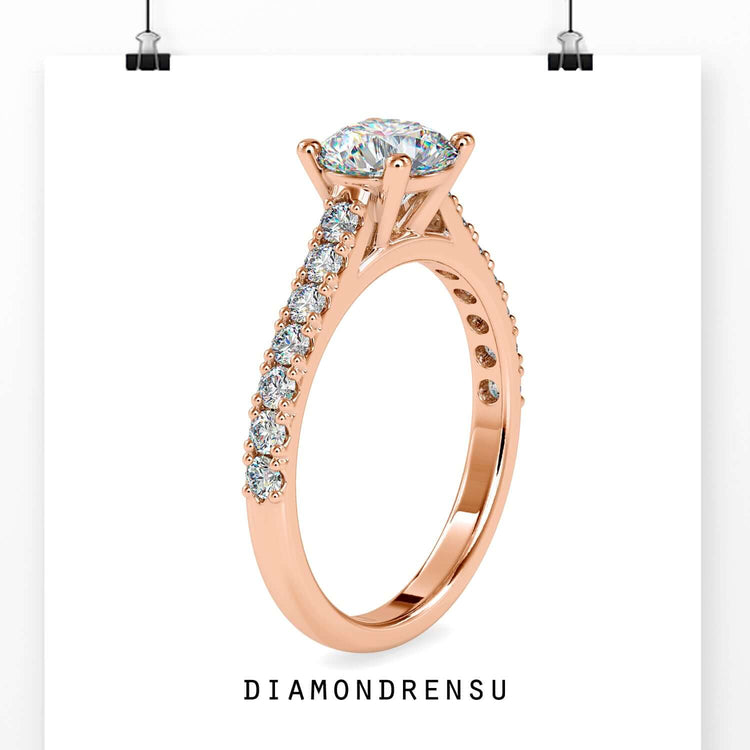 Diamondrensu UK engagement ring with round brilliant centre.