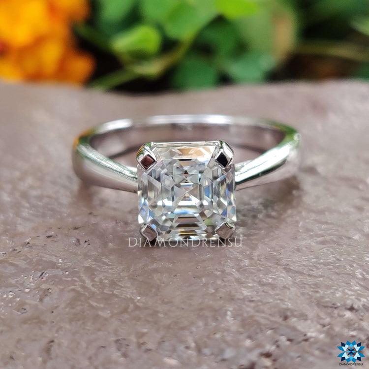 Trellis setting engagement ring with octavia cut moissanite.