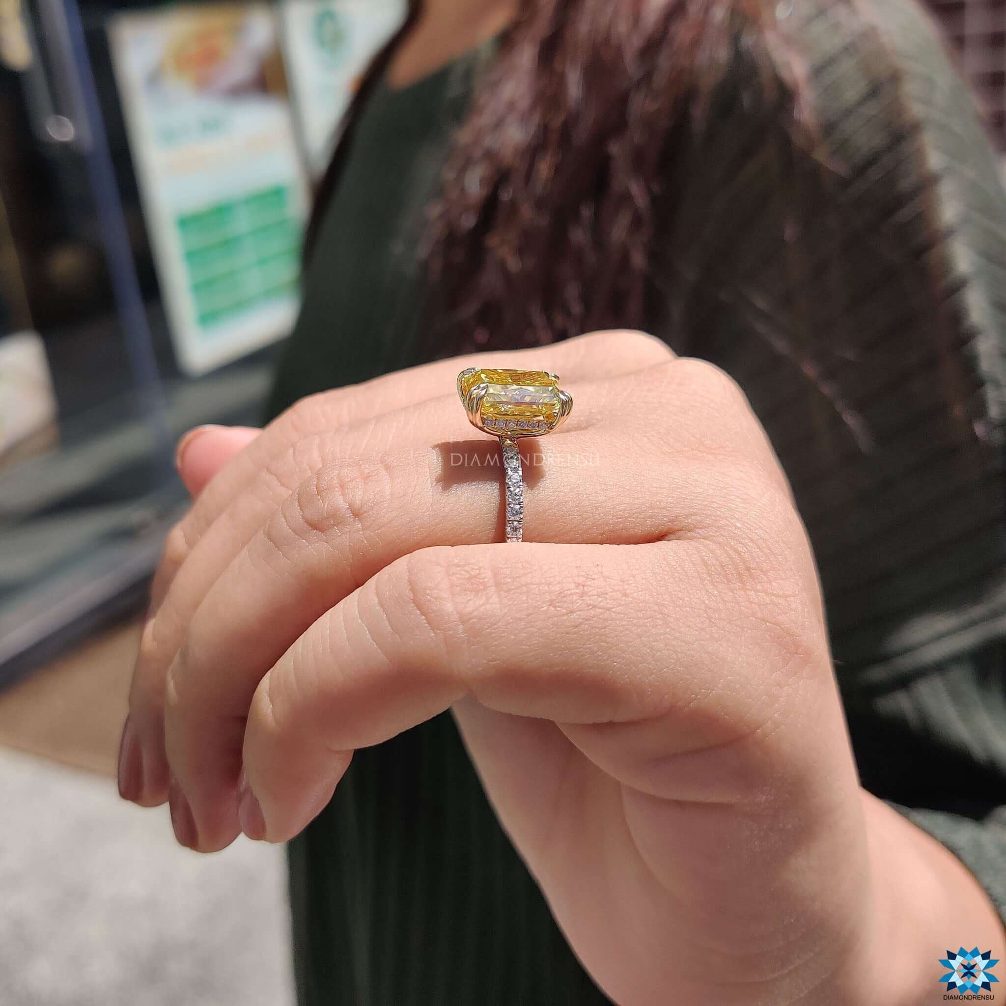 Pave setting ring with round cut center stone.