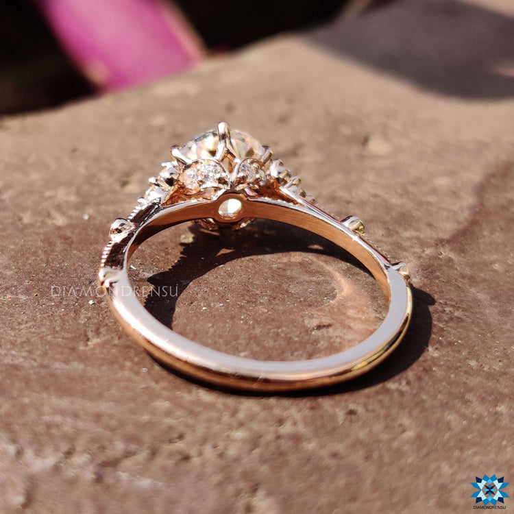 6 prong claw setting holding an old European cut moissanite.