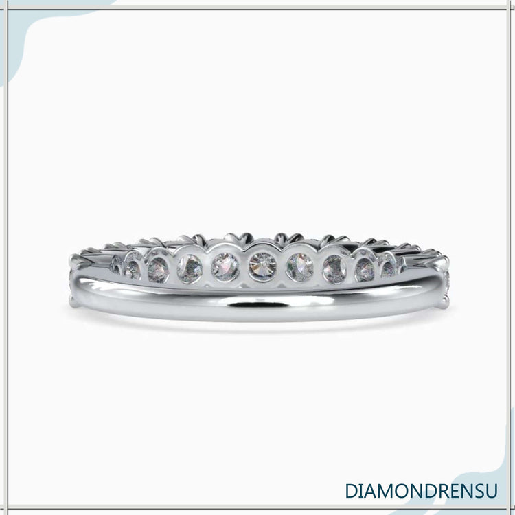 Simple wedding band in yellow gold with half diamond set.