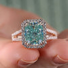 Light blue moissanite ring with cushion cut center.