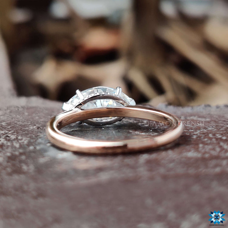 Handmade engagement ring with marquise cut and hidden halo.