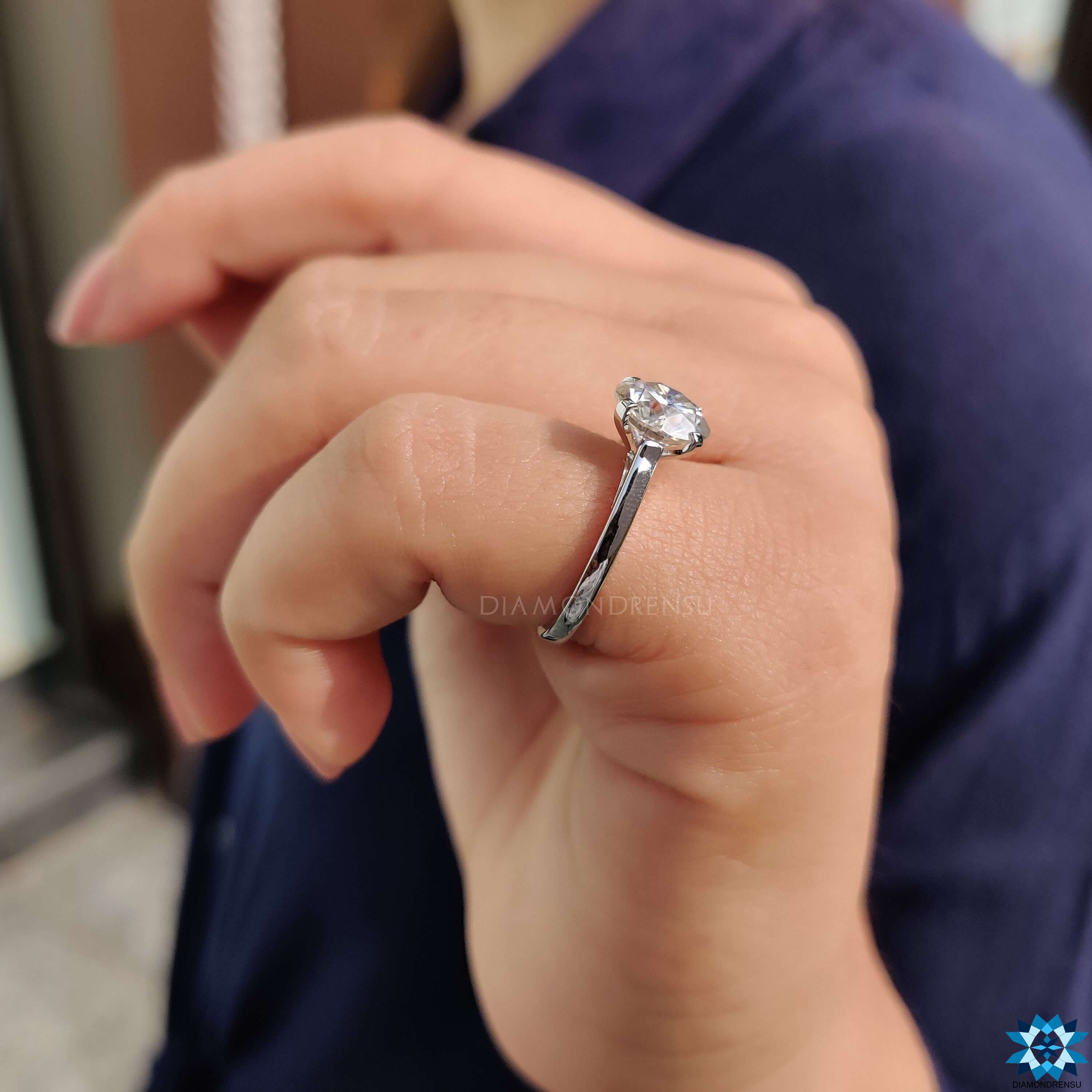 Moissanite solitaire ring in white gold.