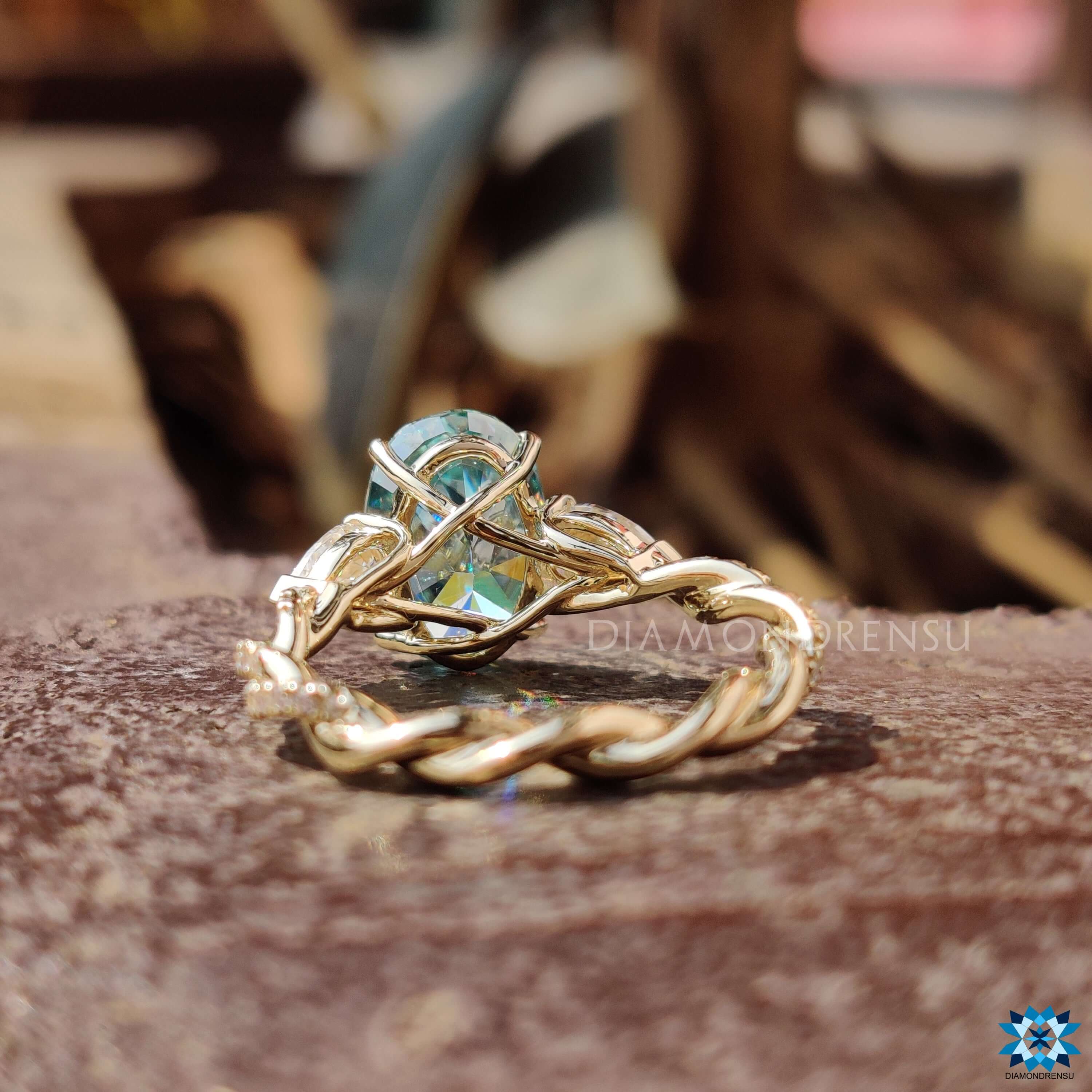 Yellow gold engagement ring with a unique twisted pave band by Diamondrensu UK.