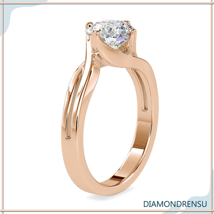 Rose gold ring with heart prong setting, ideal for a custom engagement ring.