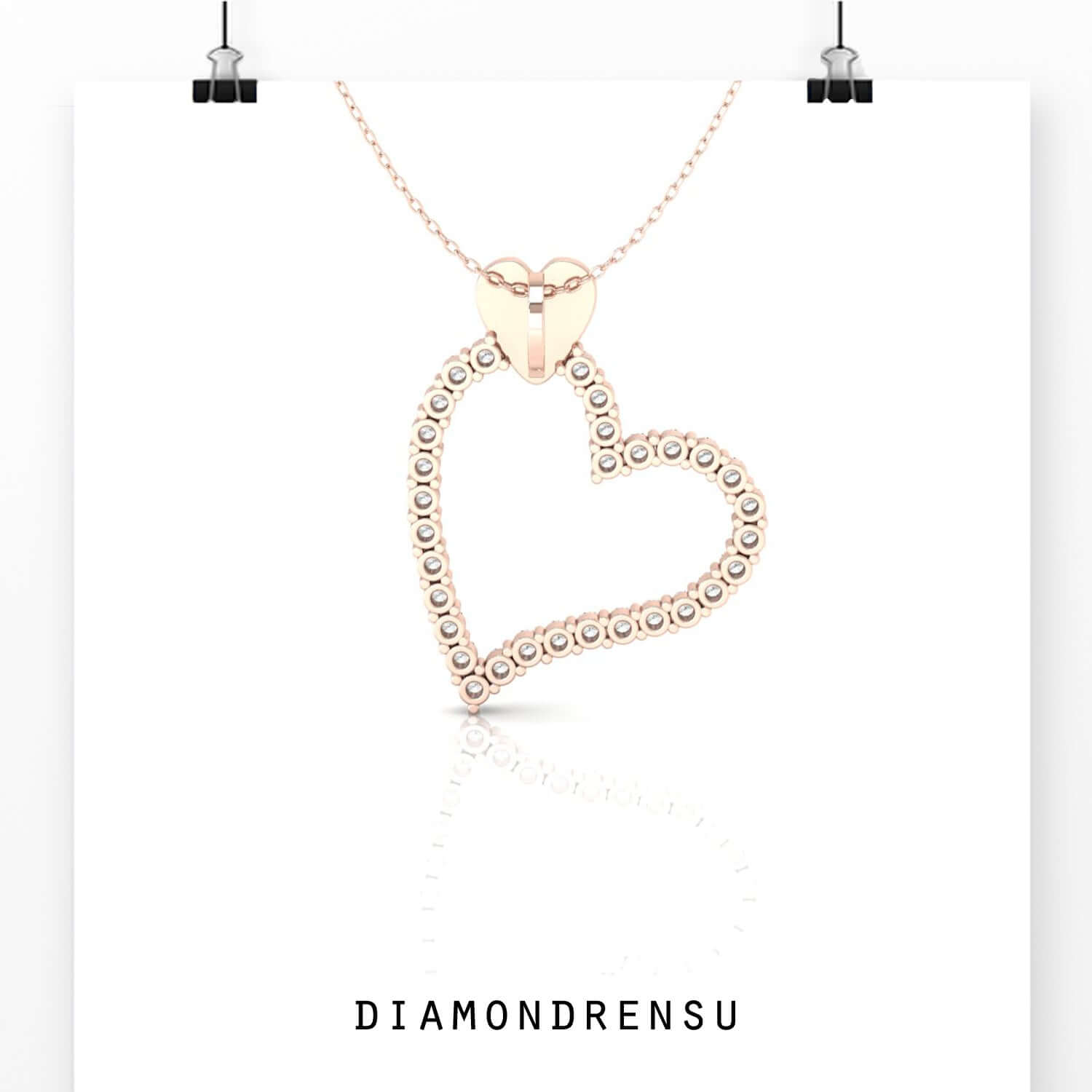 Shared prong setting heart pendant with brilliant round diamond.