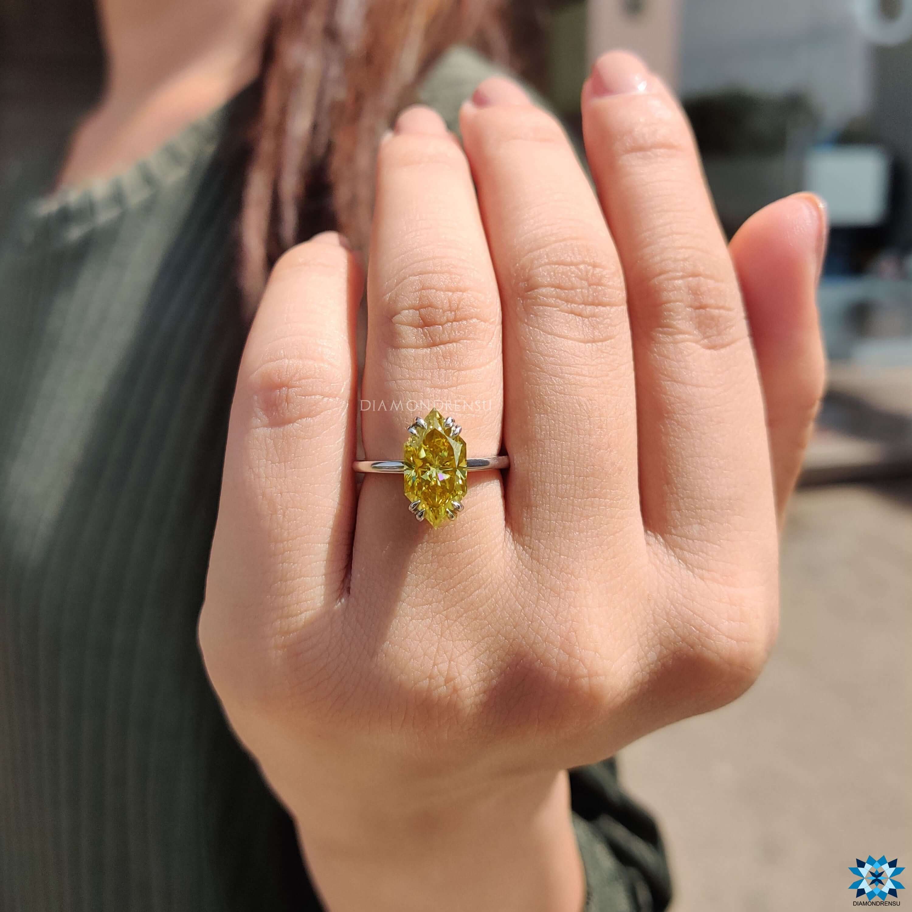Buy moissanite ring with a bold yellow center stone.