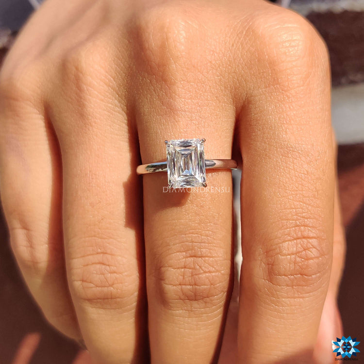 White gold moissanite ring with criss cut center in cathedral setting.
