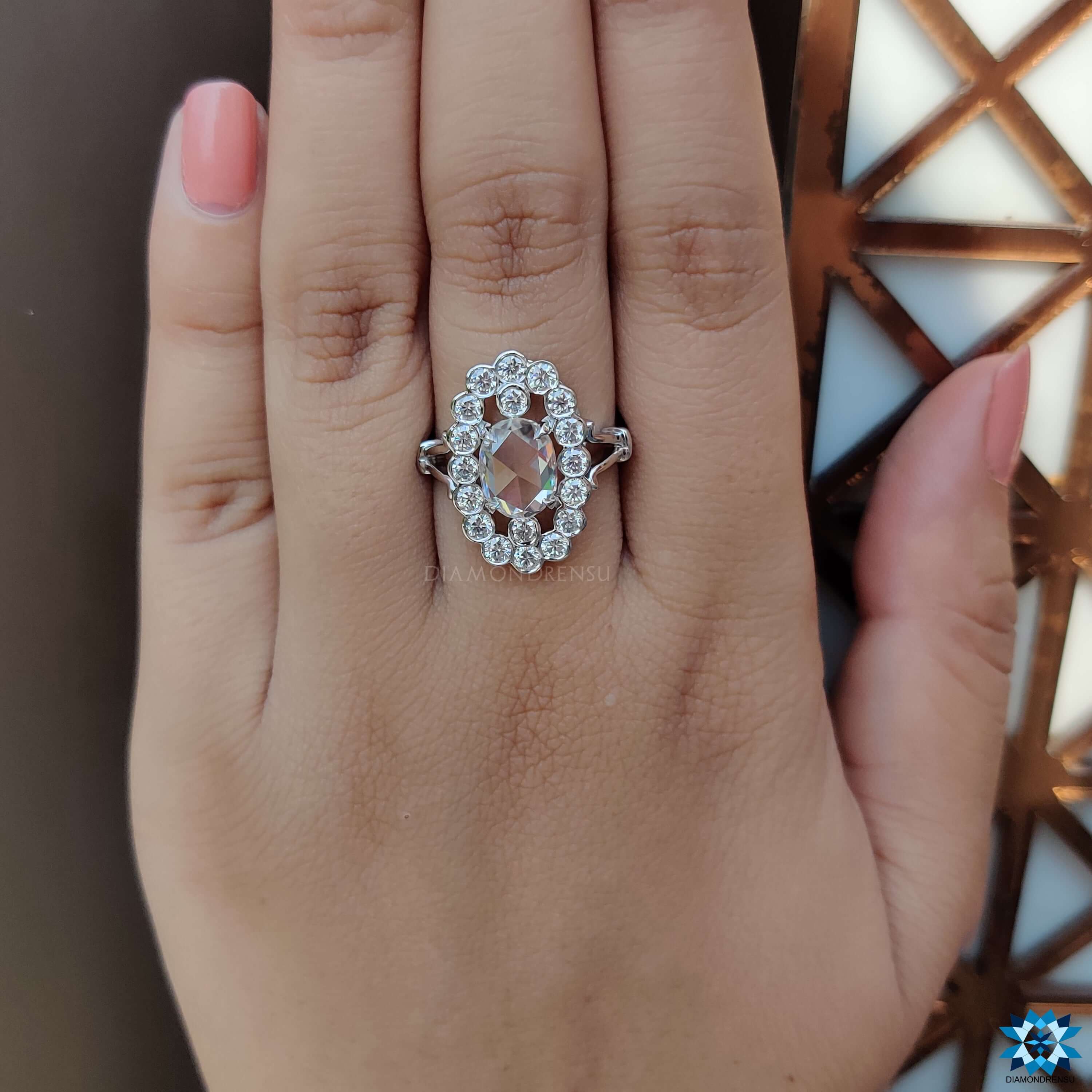 Custom engagement ring featuring rose cut moissanite and round halo.