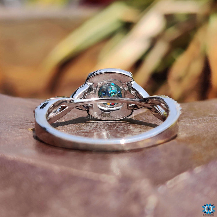 White gold ring with twisted band design.