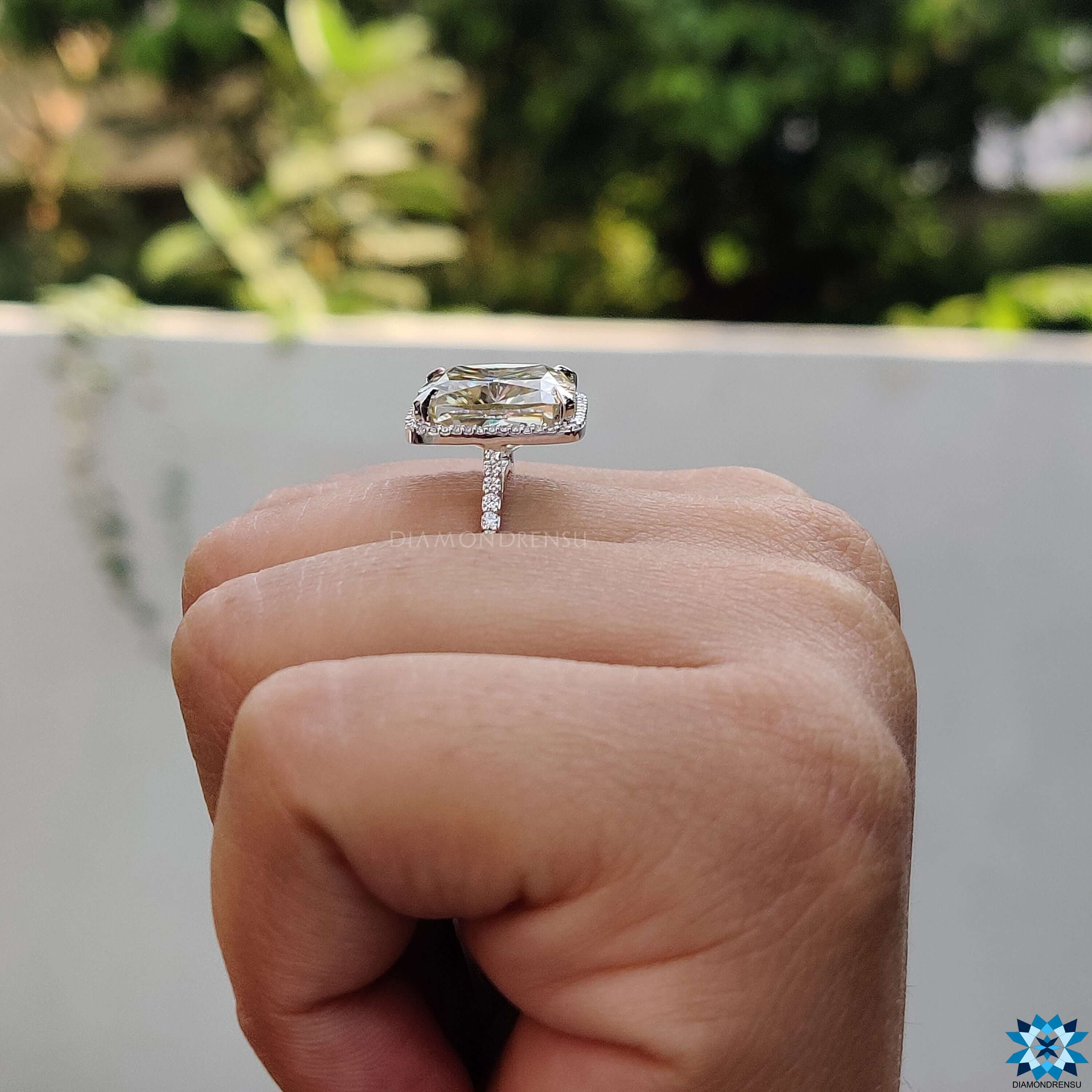 Custom white gold ring with light yellow moissanite center.