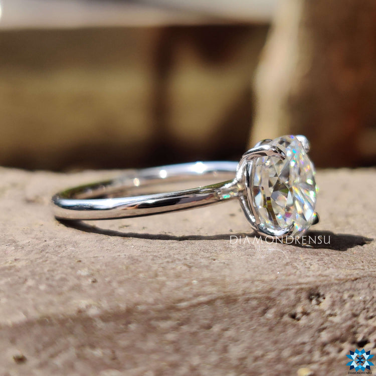 Moissanite engagement ring with four prong mount.