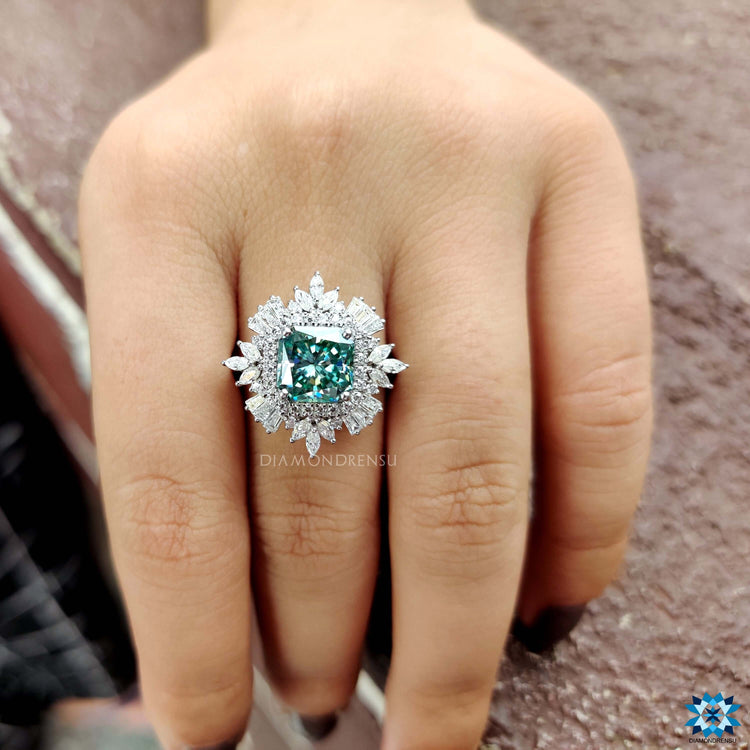 Blue moissanite ring with marquise and baguette side stones.