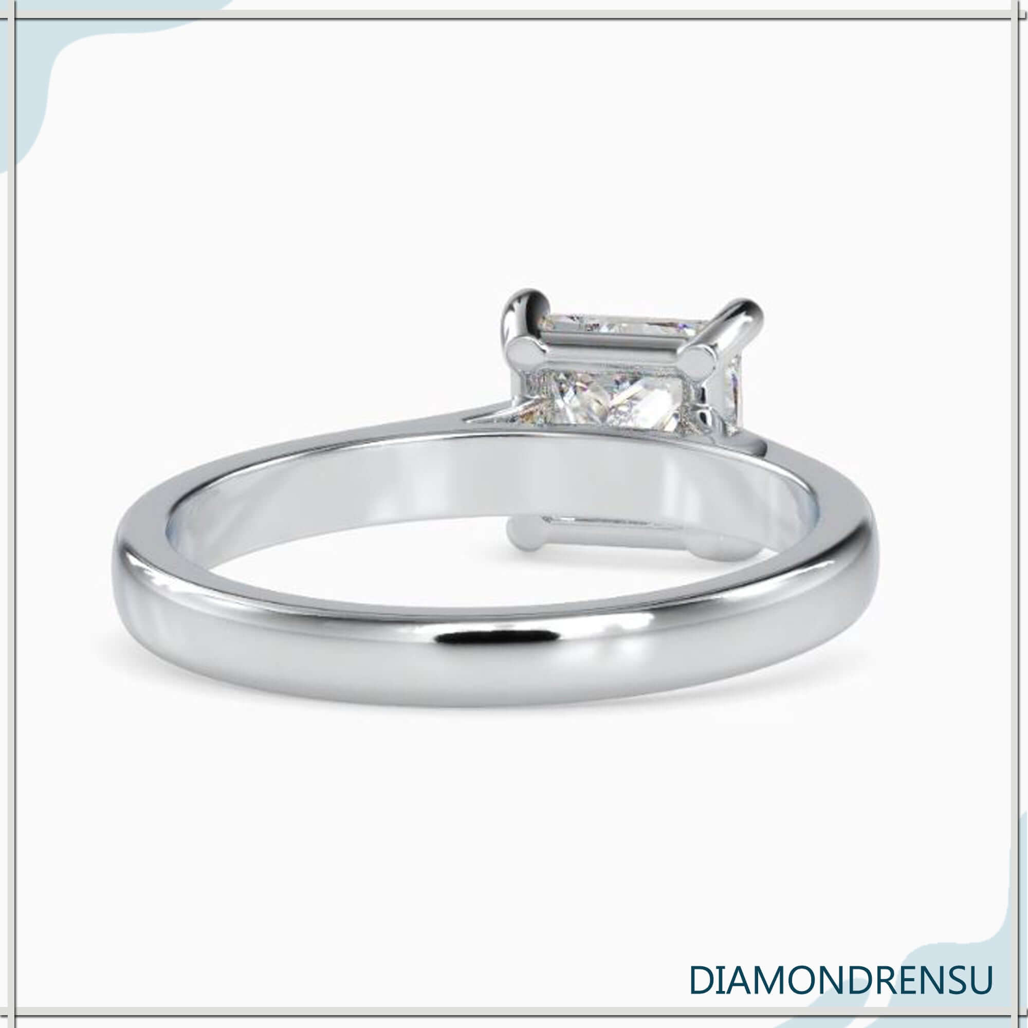 Princess cut diamond ring with 4 round prong in white gold band.