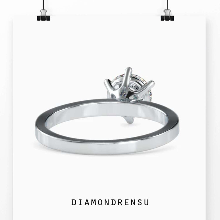 Round diamond ring in yellow gold with secure 6 prong setting.