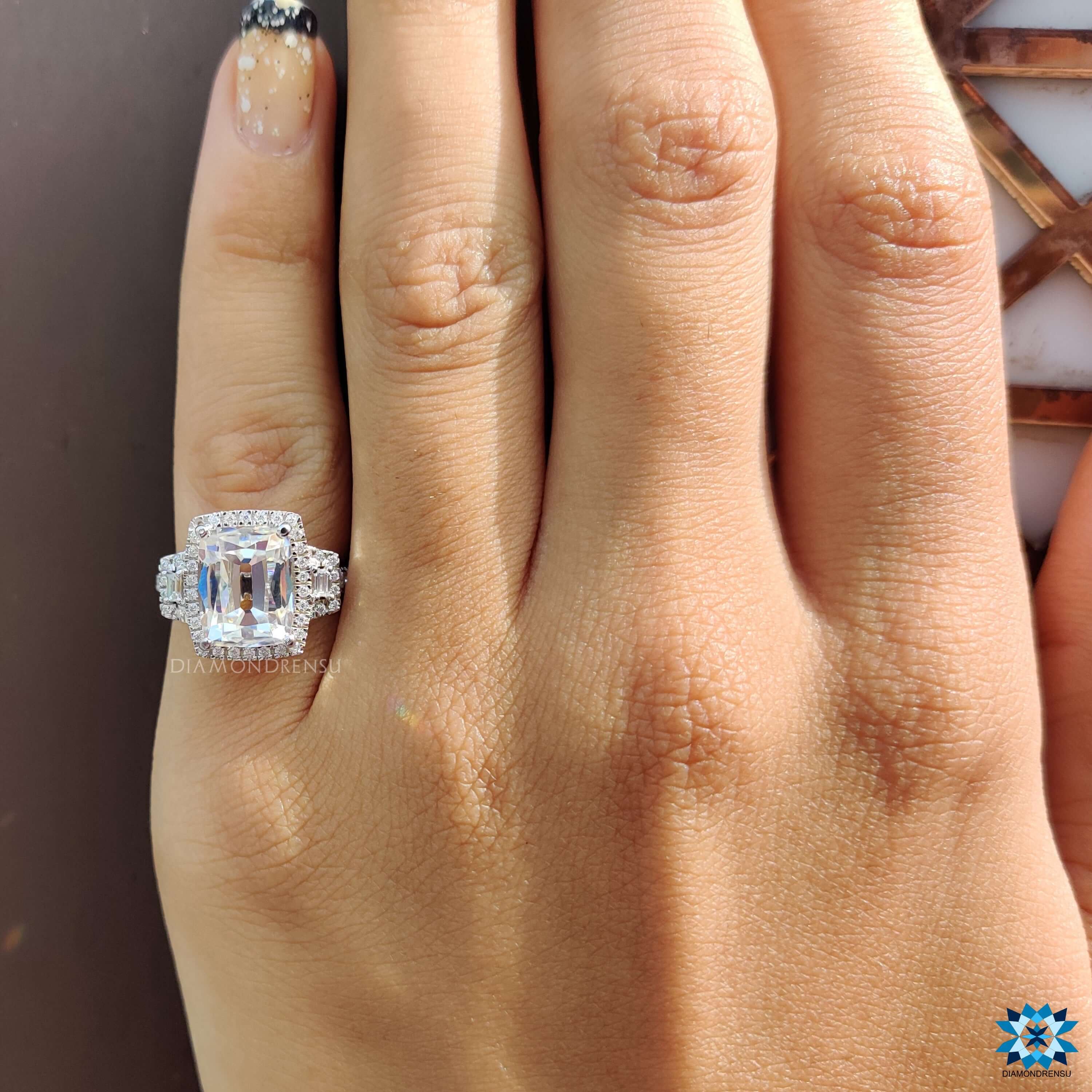 Custom vintage engagement ring with halo and prongs.