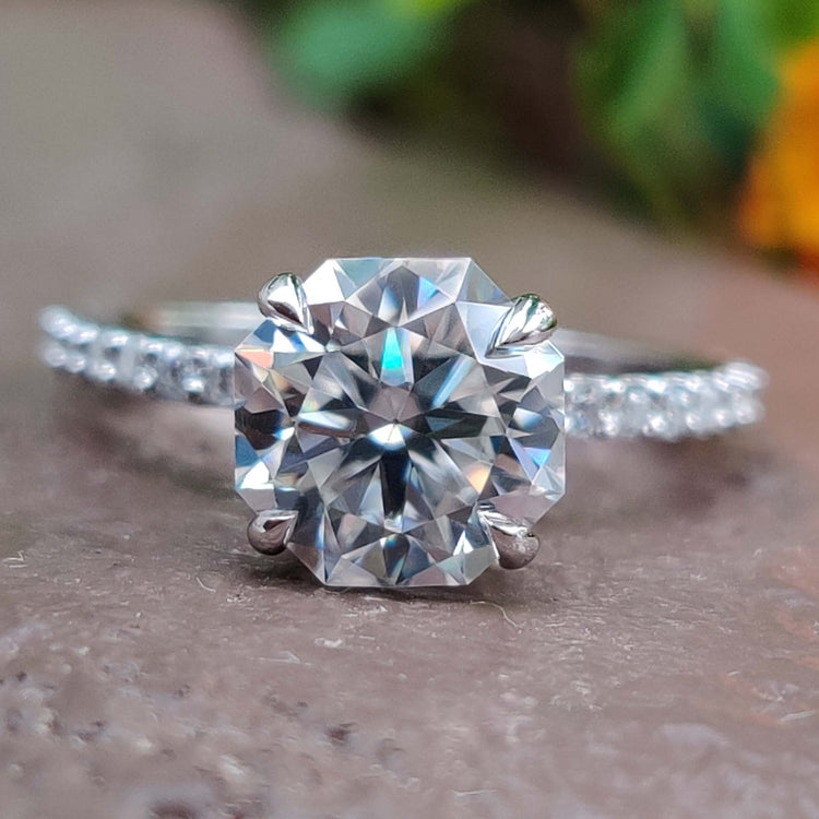 Octagon cut moissanite engagement ring with hidden halo.