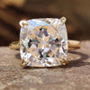 Cushion Rensu cut moissanite engagement ring in yellow gold.