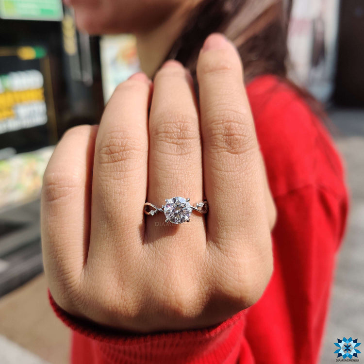 Twisted shank ring with round moissanite.